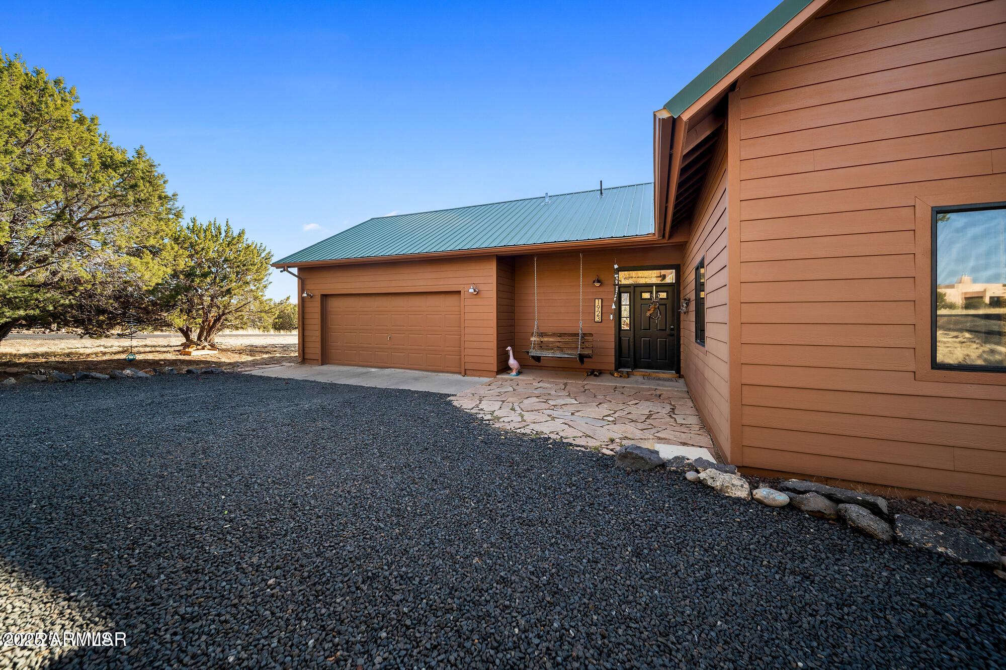 1923 Creekside Circle Show Low, AZ 85901 - Photo 26 of 71 a view of a house with a yard and garage