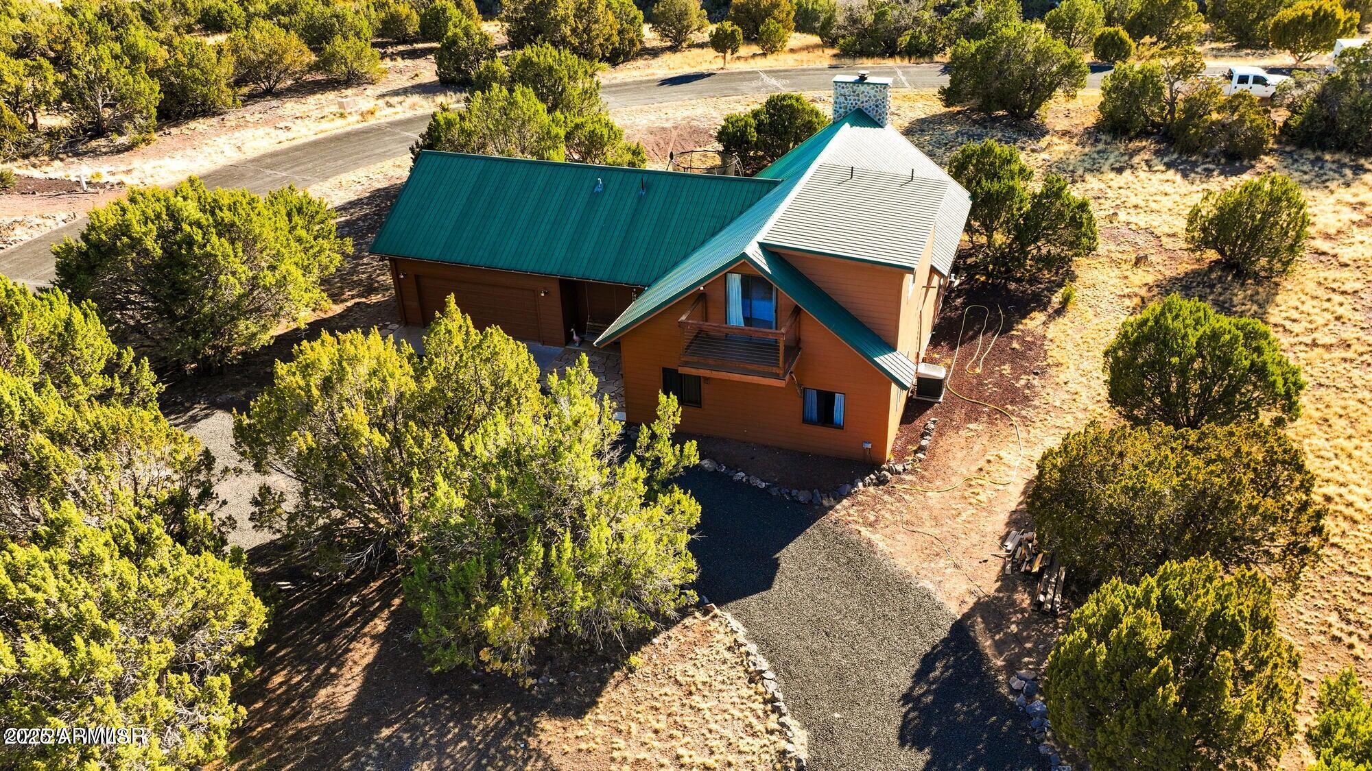 1923 Creekside Circle Show Low, AZ 85901 - Photo 28 of 71 a view of house with a yard and sitting area