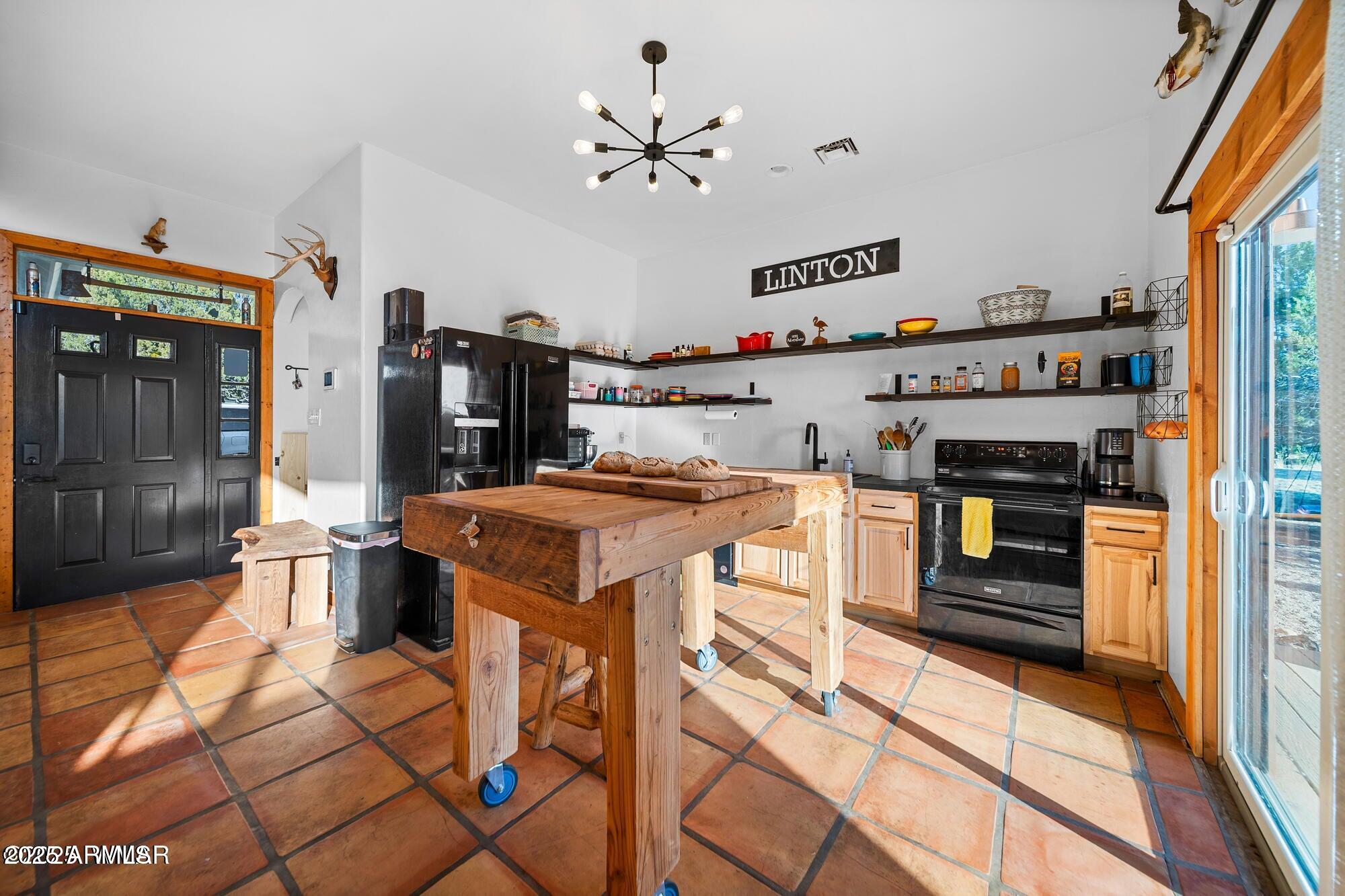 1923 Creekside Circle Show Low, AZ 85901 - Photo 31 of 71 a kitchen with a stove and a refrigerator