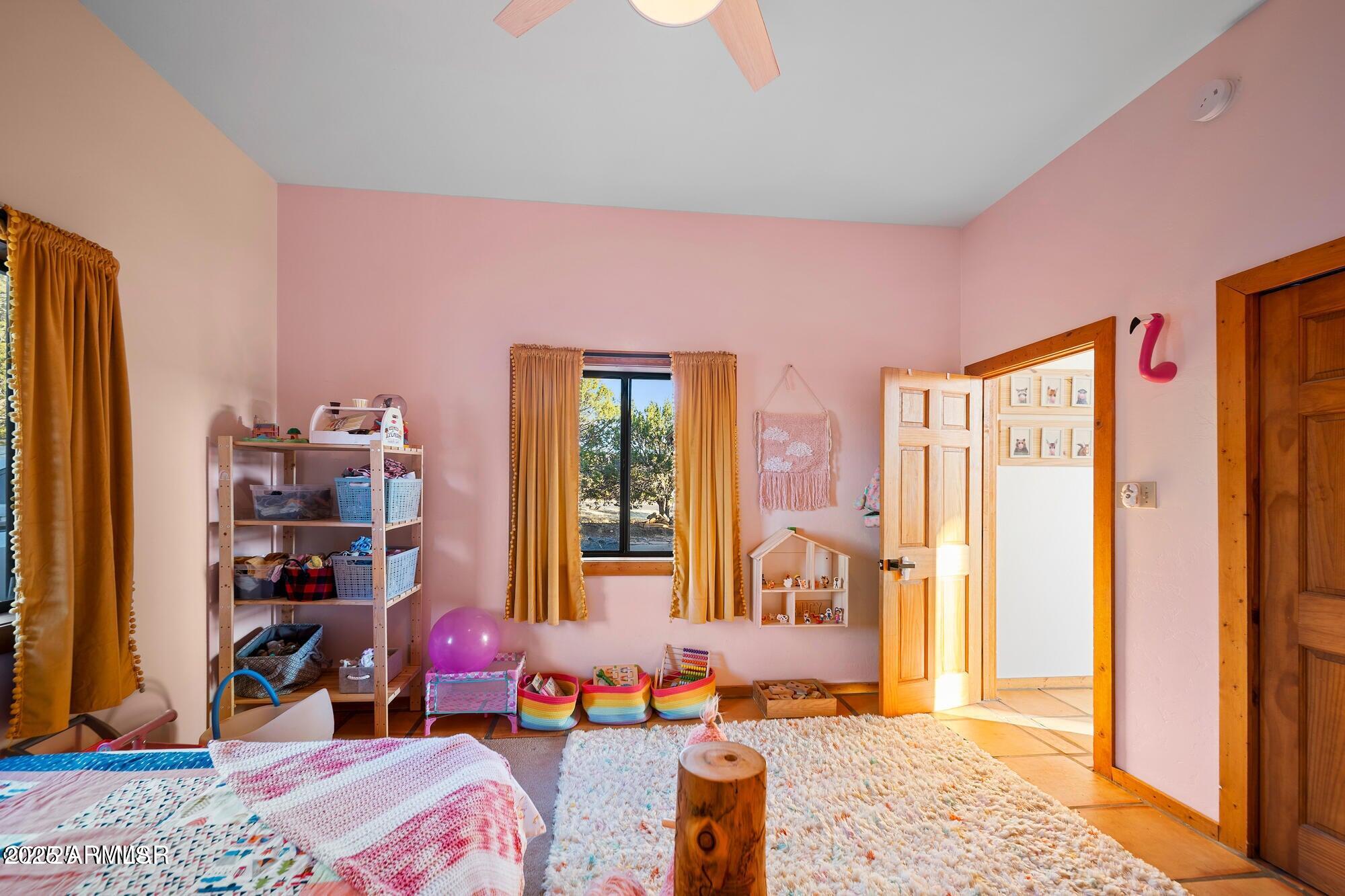 1923 Creekside Circle Show Low, AZ 85901 - Photo 41 of 71 a bedroom with furniture and a large window
