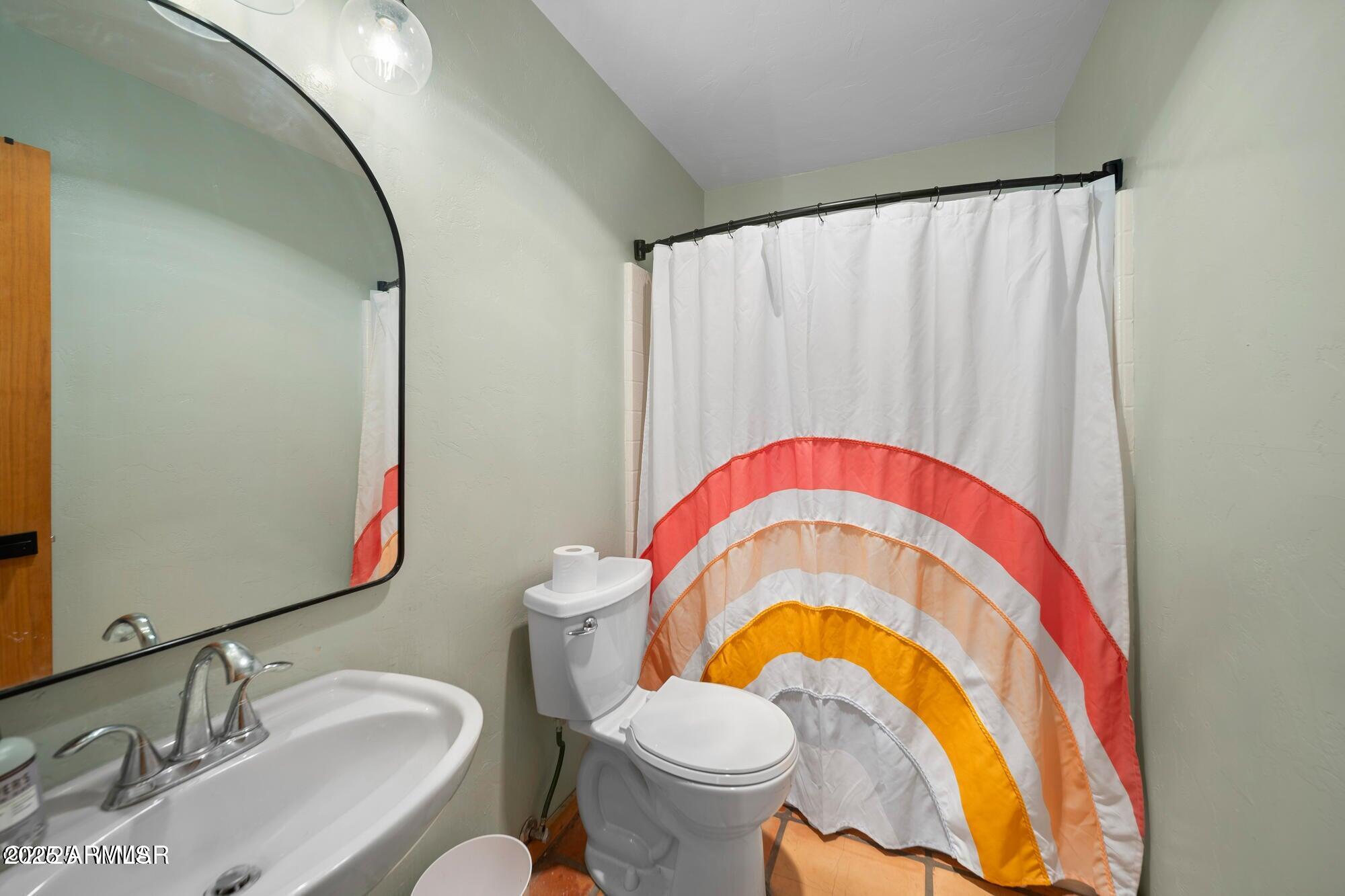 1923 Creekside Circle Show Low, AZ 85901 - Photo 42 of 71 a bathroom with a sink and a mirror