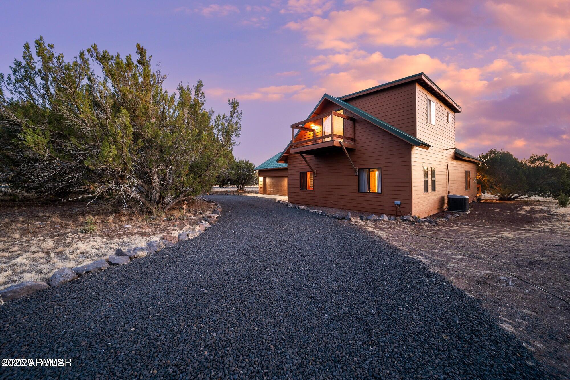 1923 Creekside Circle Show Low, AZ 85901 - Photo 5 of 71 a view of a house with a yard