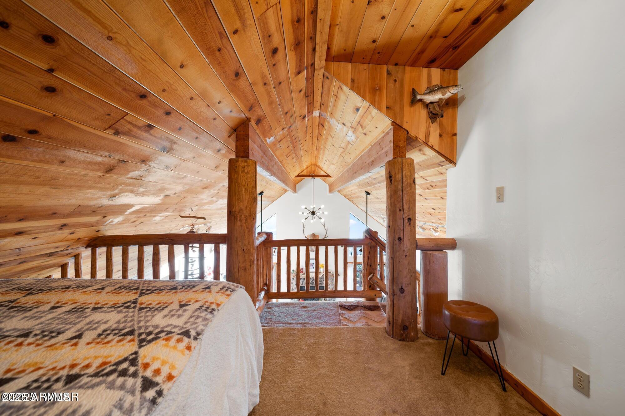 1923 Creekside Circle Show Low, AZ 85901 - Photo 56 of 71 a bed sitting in a bedroom next to a window