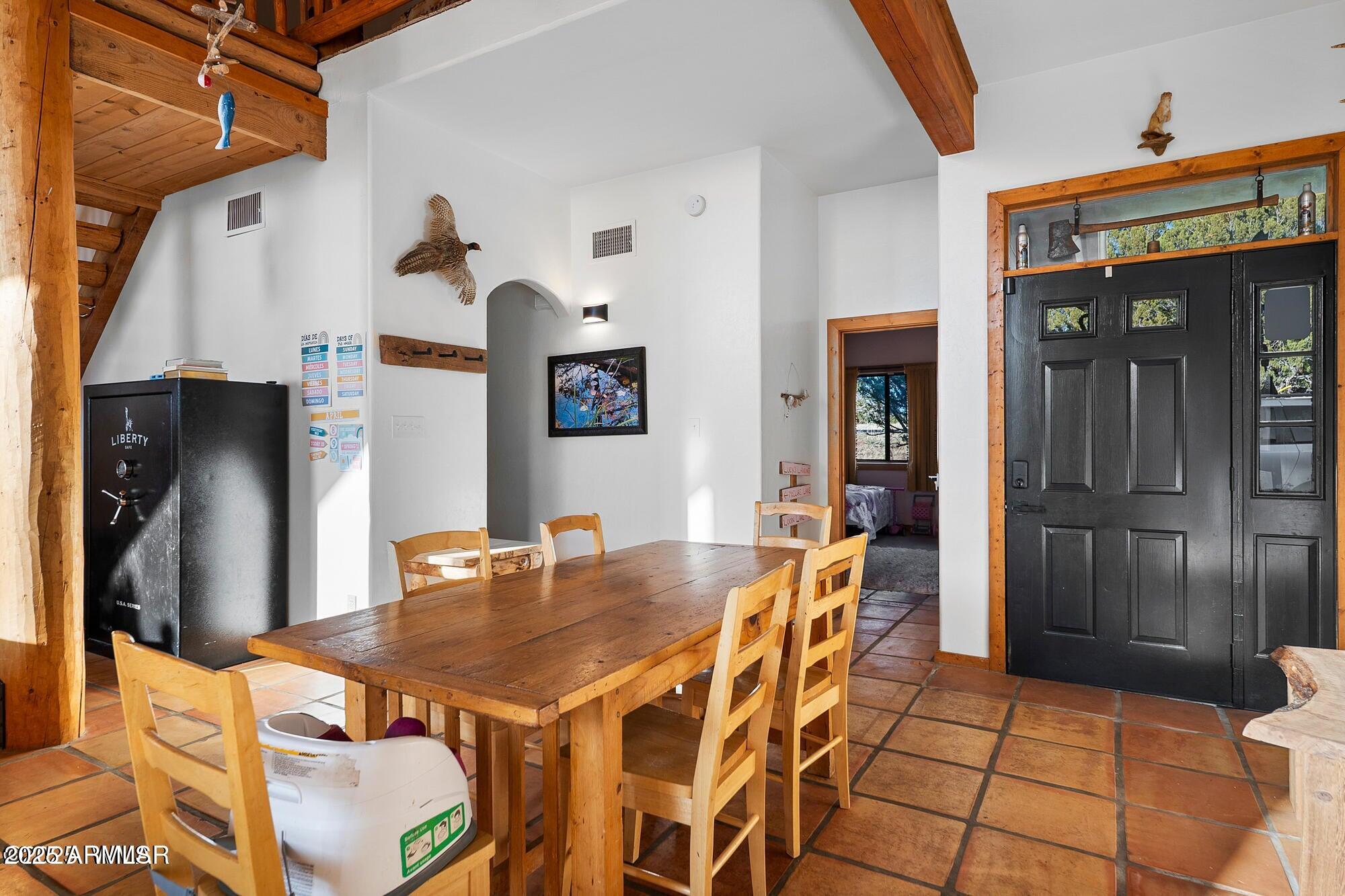 1923 Creekside Circle Show Low, AZ 85901 - Photo 62 of 71 a view of a dining room with furniture and chandelier