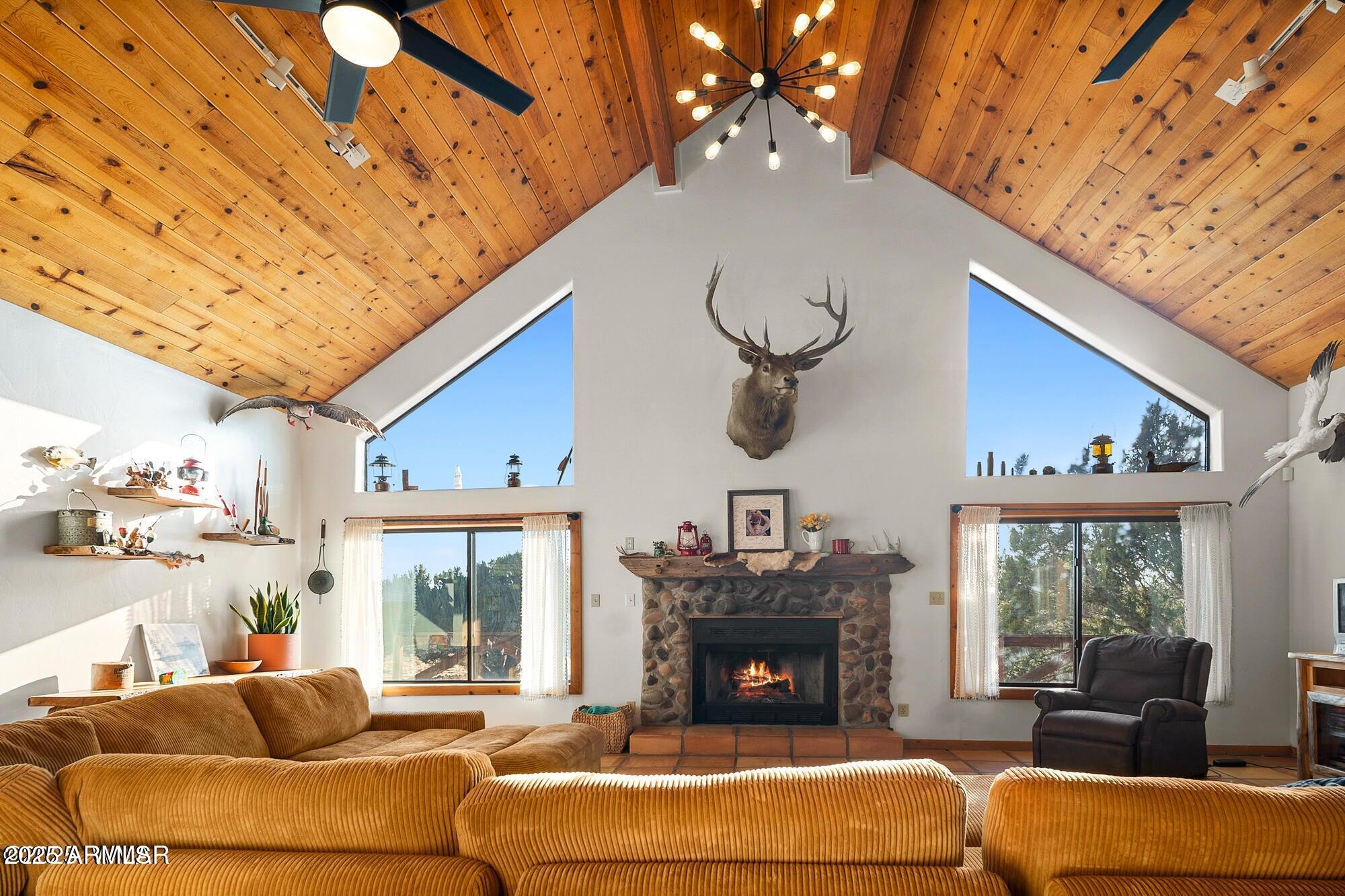 1923 Creekside Circle Show Low, AZ 85901 - Photo 66 of 71 a living room with furniture a fireplace and a flat screen tv
