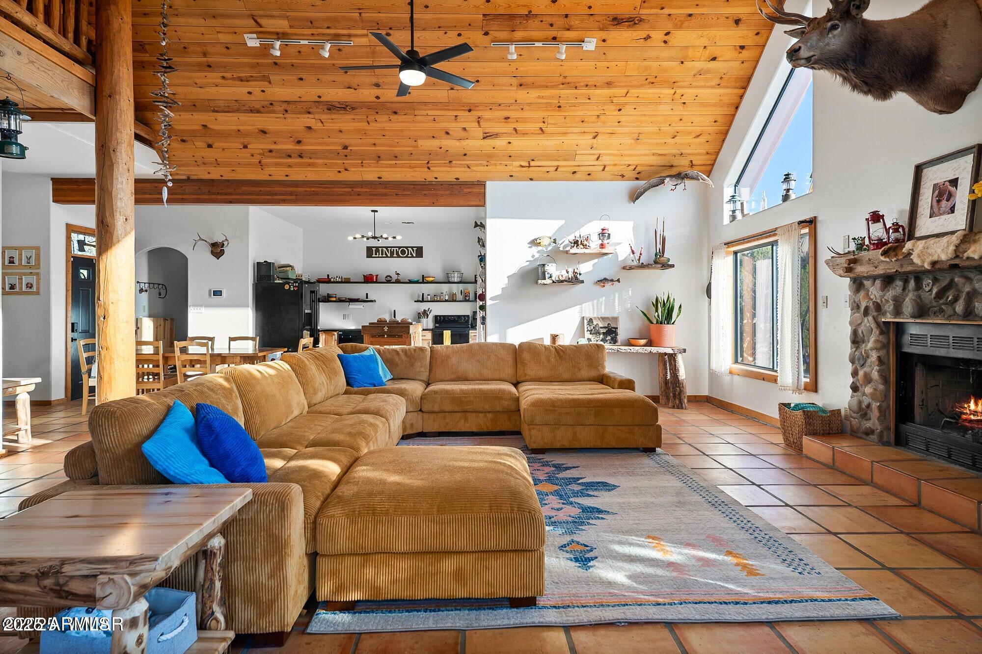1923 Creekside Circle Show Low, AZ 85901 - Photo 69 of 71 a living room with furniture a fireplace and a flat screen tv