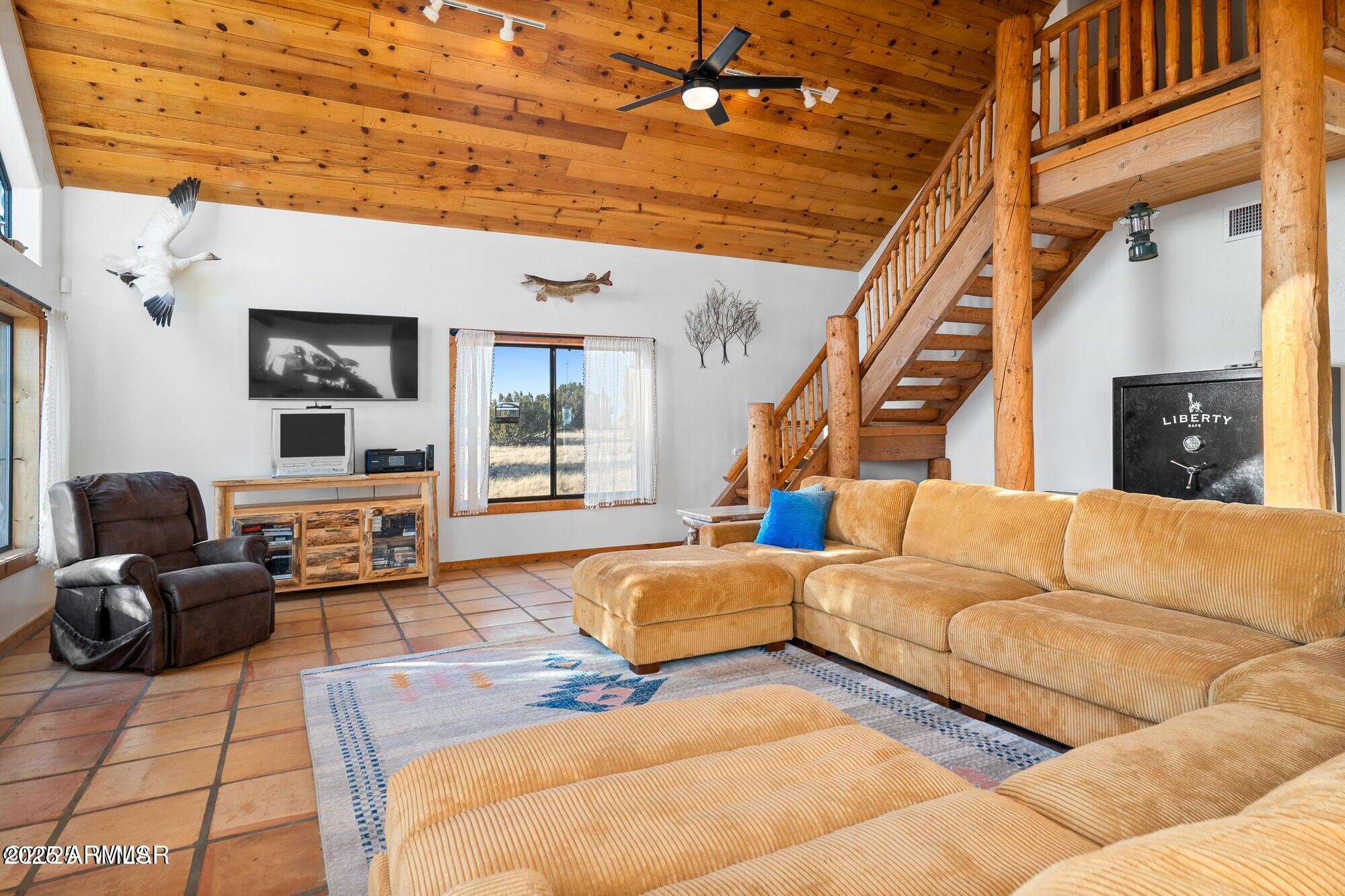 1923 Creekside Circle Show Low, AZ 85901 - Photo 71 of 71 a living room with furniture ceiling fan and a rug