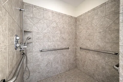 a view of a kitchen with wooden floor and cabinets