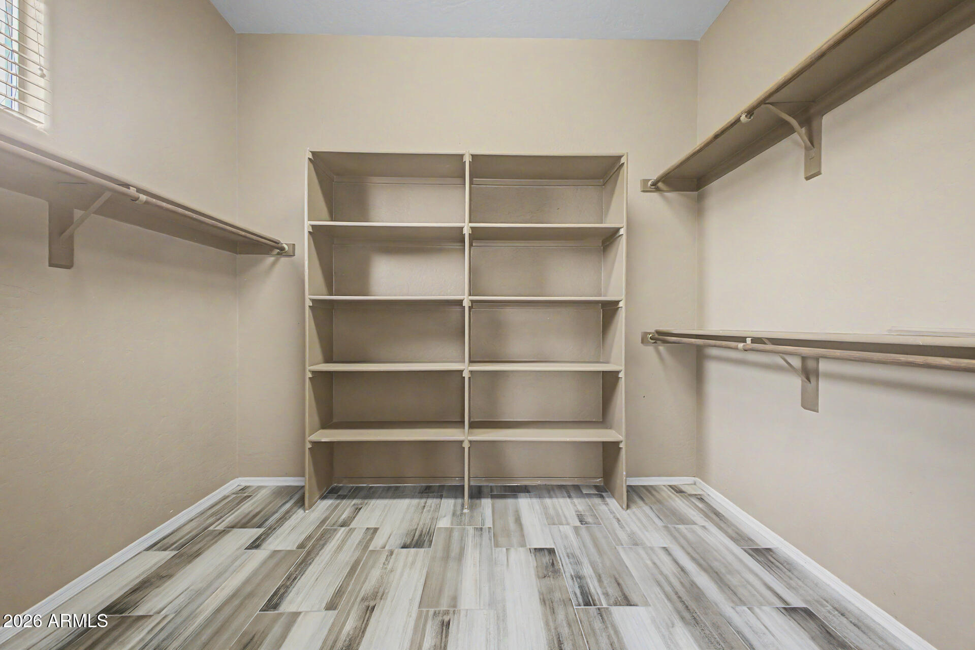 5090 South Ranger Trail Gilbert, AZ 85298 - Photo 19 of 50 a room with walk in closet and empty racks