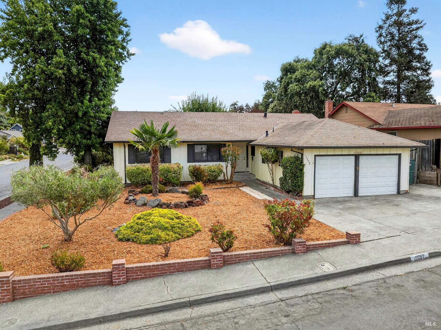 1552 Moonview Court Santa Rosa, CA 95401 - Photo 1 of 1 a front view of a house with garden