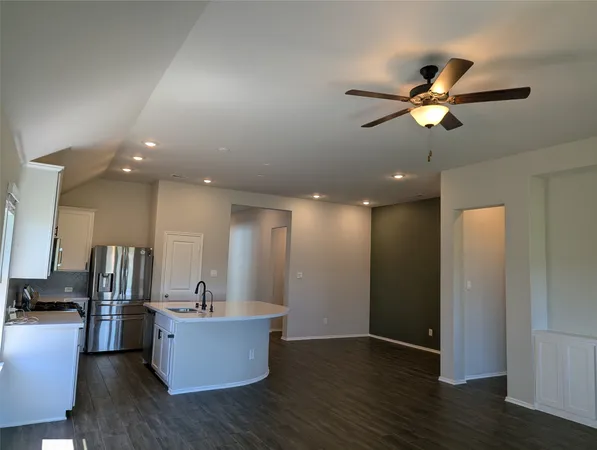 a view of a living room and wooden floor