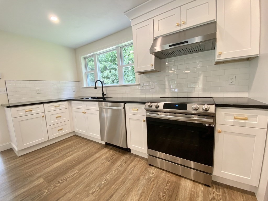 5 Wellesley Avenue Worcester, MA 01605 - Photo 11 of 31 a kitchen with a stove and a sink