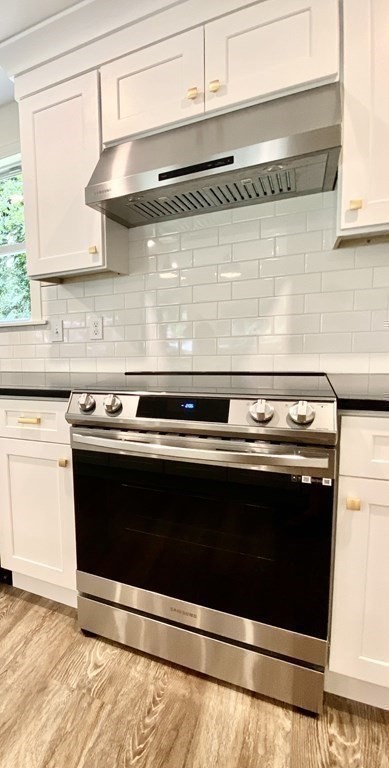 5 Wellesley Avenue Worcester, MA 01605 - Photo 18 of 31 a stove top oven sitting inside of a kitchen