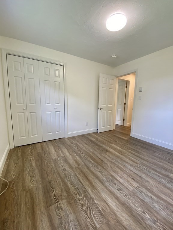 5 Wellesley Avenue Worcester, MA 01605 - Photo 20 of 31 a view of an empty room and wooden floor