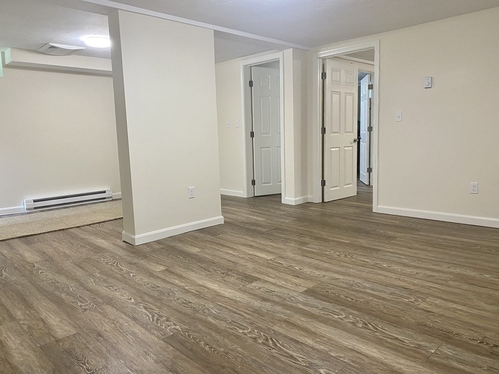 5 Wellesley Avenue Worcester, MA 01605 - Photo 24 of 31 an empty room with wooden floor and closet