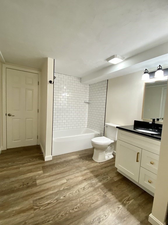 5 Wellesley Avenue Worcester, MA 01605 - Photo 26 of 31 a bathroom with a toilet sink and a mirror