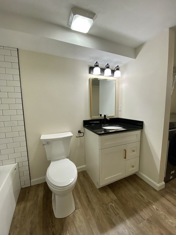 5 Wellesley Avenue Worcester, MA 01605 - Photo 28 of 31 a bathroom with a toilet and a mirror