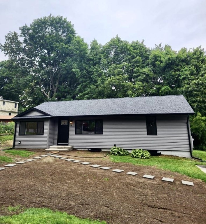 5 Wellesley Avenue Worcester, MA 01605 - Photo 3 of 31 a front view of a house with a garden