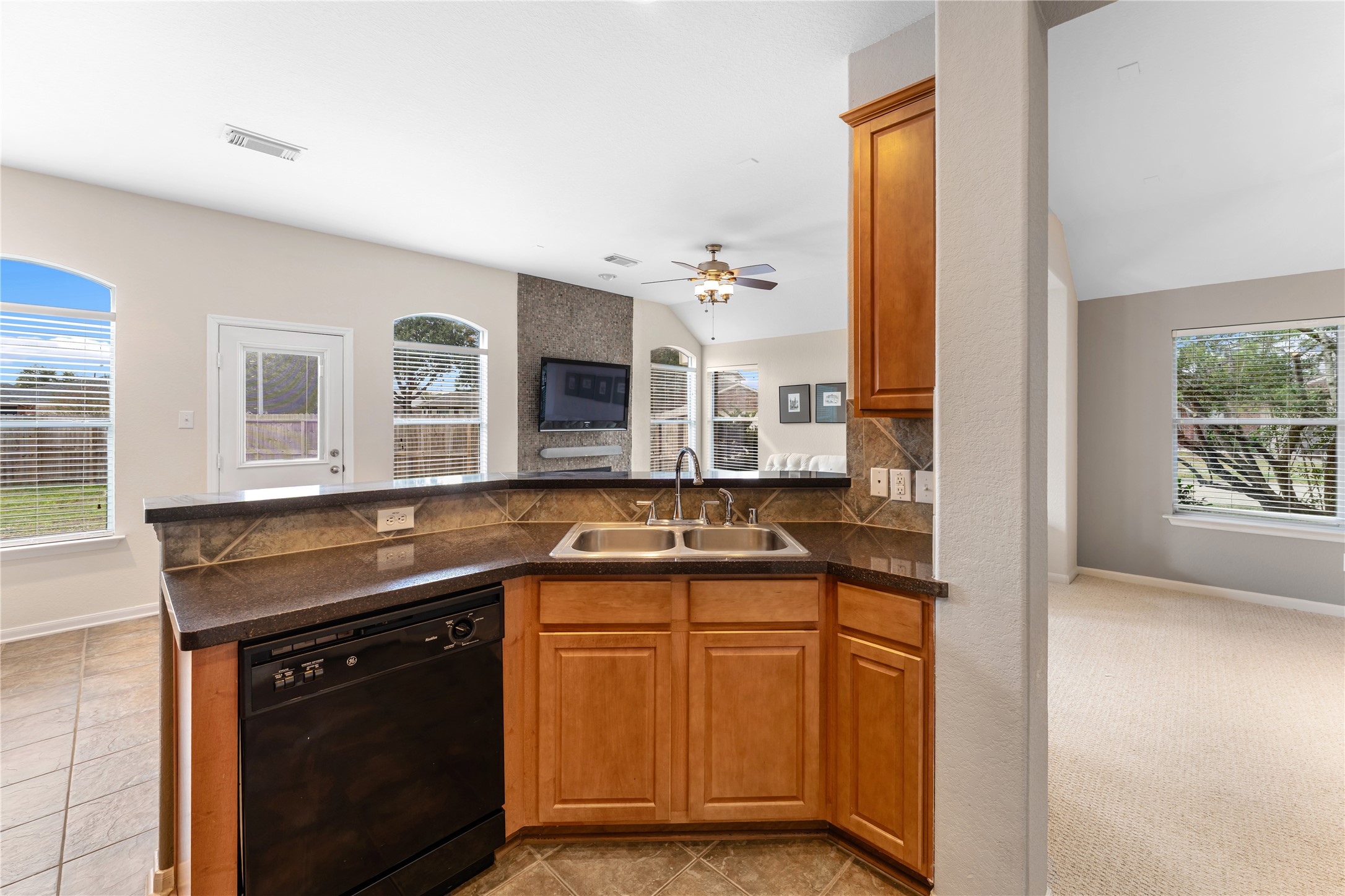 3214 Falcon Trail Drive Spring, TX 77373 - Photo 14 of 29 a kitchen with granite countertop a sink and cabinets