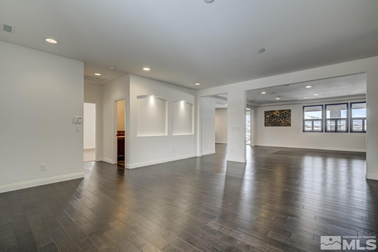2105 Back Nine Trail Reno, NV 89523 - Photo 14 of 25 an empty room with wooden floor and windows