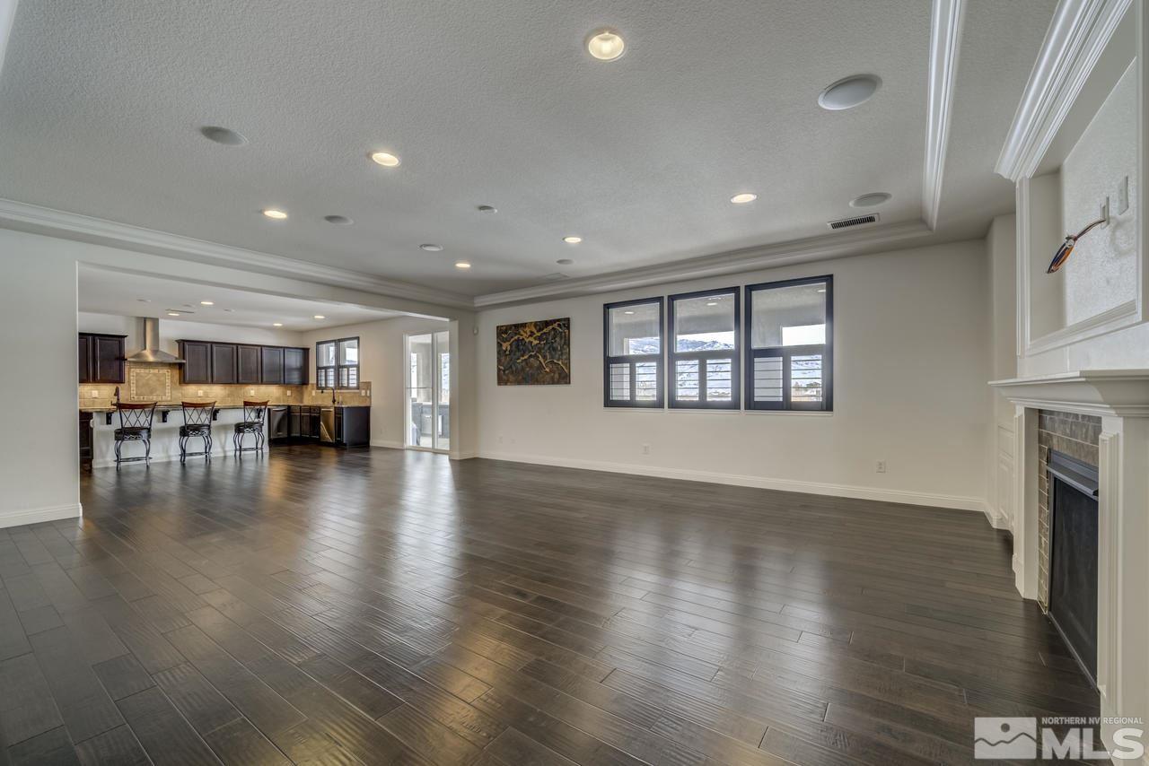 2105 Back Nine Trail Reno, NV 89523 - Photo 4 of 25 a view of an empty room with wooden floor and a window
