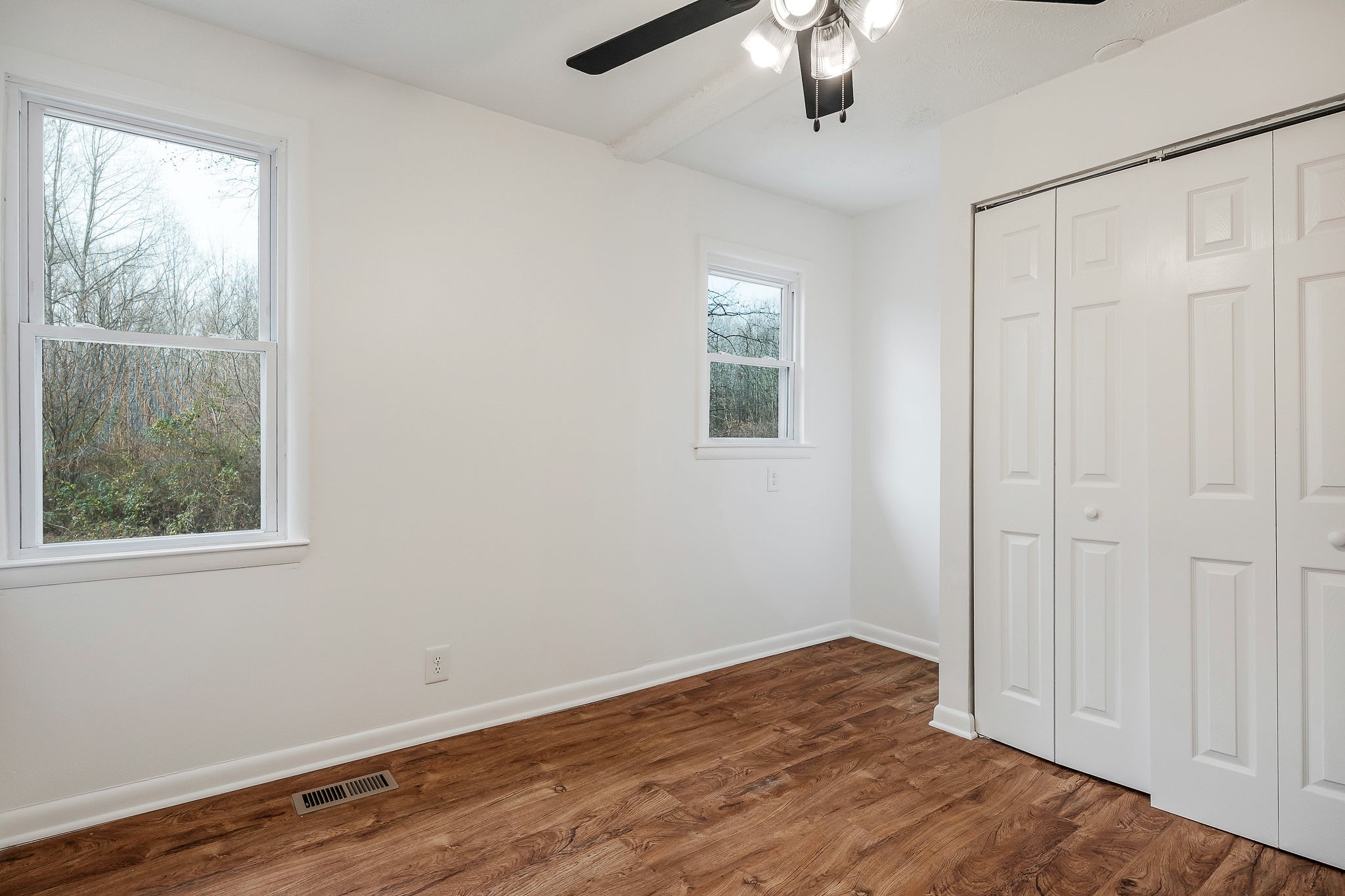 240 Blue Hill Road Woodbury, TN 37190 - Photo 11 of 17 a view of an empty room with wooden floor and a window