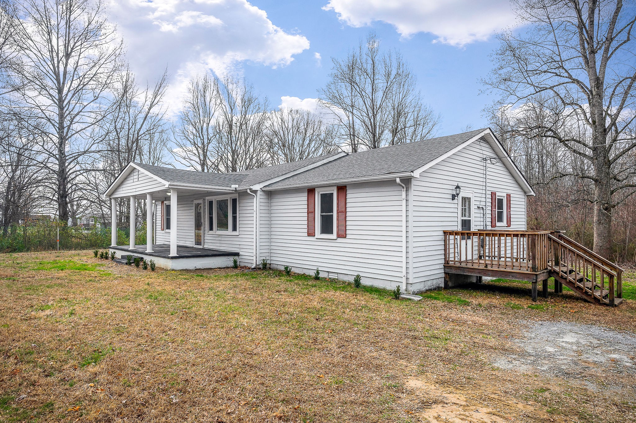 240 Blue Hill Road Woodbury, TN 37190 - Photo 2 of 17 a view of a house with a yard patio and fire pit