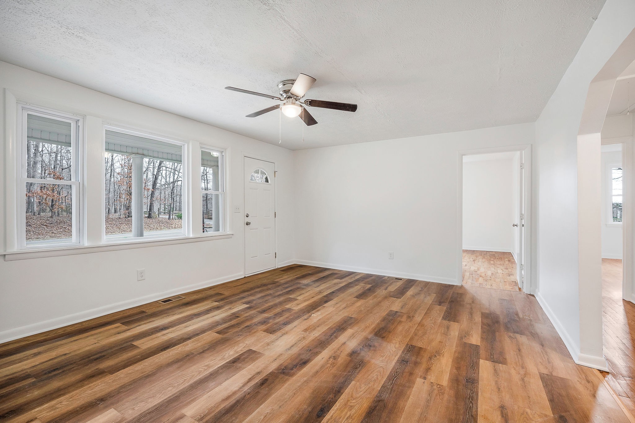 240 Blue Hill Road Woodbury, TN 37190 - Photo 3 of 17 a view of empty room with wooden floor and fan