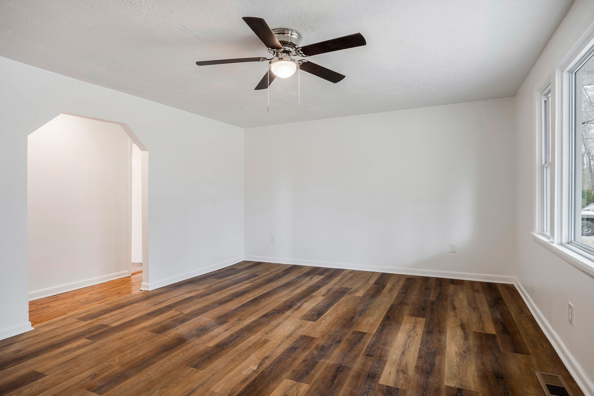 240 Blue Hill Road Woodbury, TN 37190 - Photo 4 of 17 wooden floor in an empty room with a window