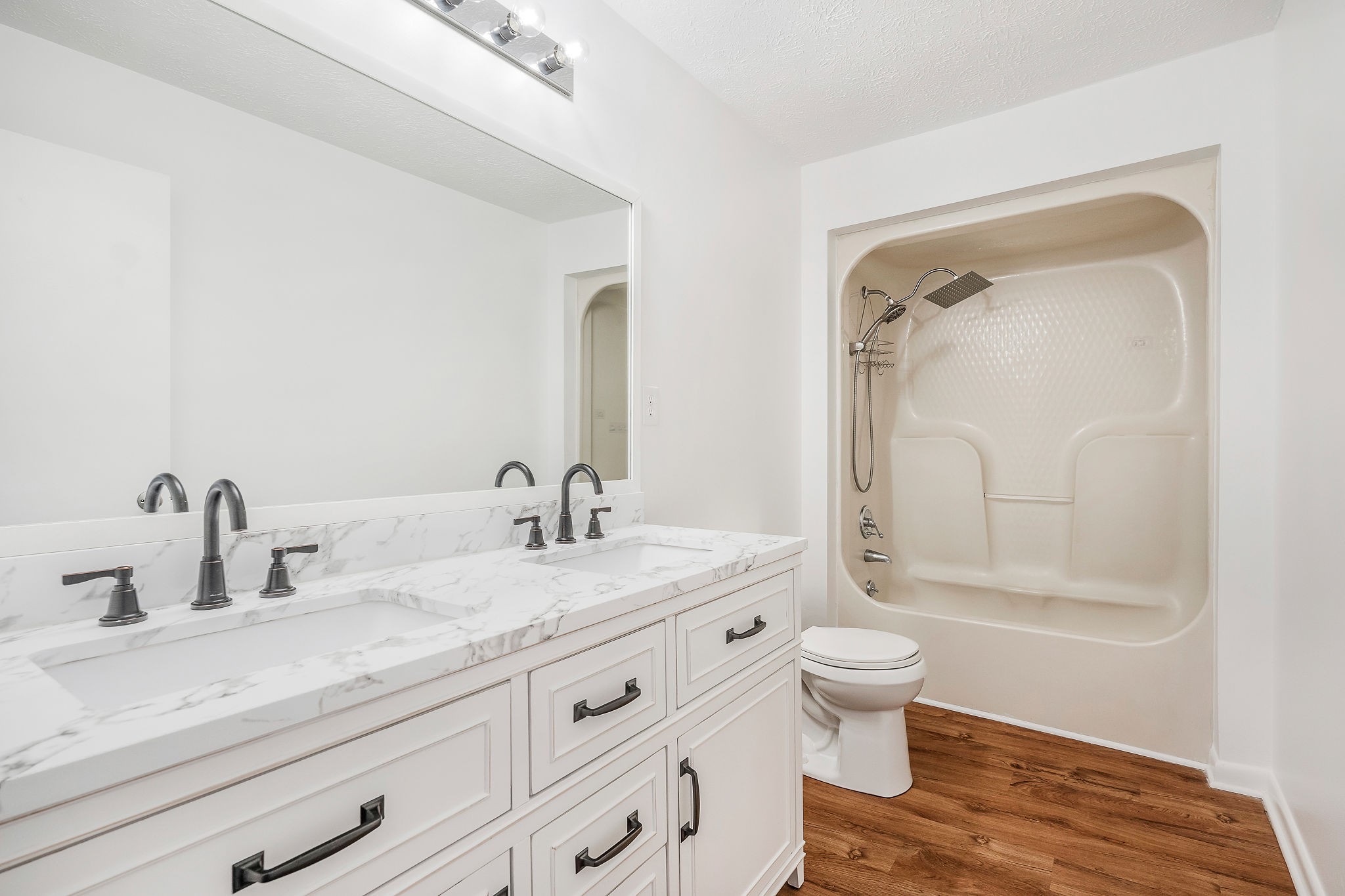 240 Blue Hill Road Woodbury, TN 37190 - Photo 10 of 17 a bathroom with a granite countertop sink a toilet and a mirror