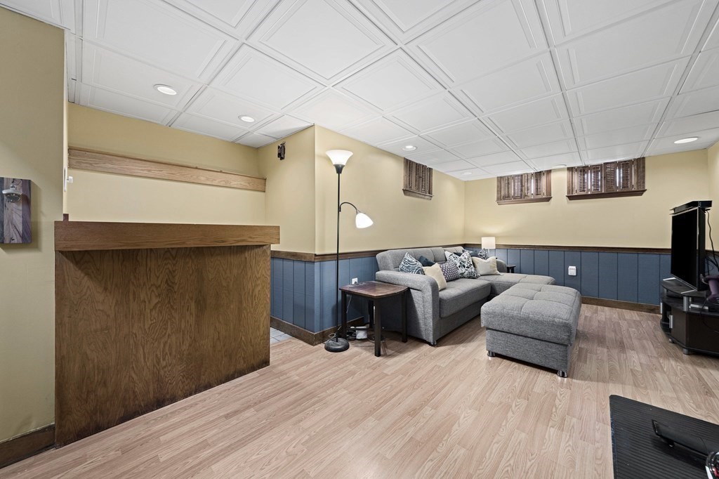 14 Edith Road Weymouth, MA 02189 - Photo 22 of 35 a bedroom with furniture and a wooden floor