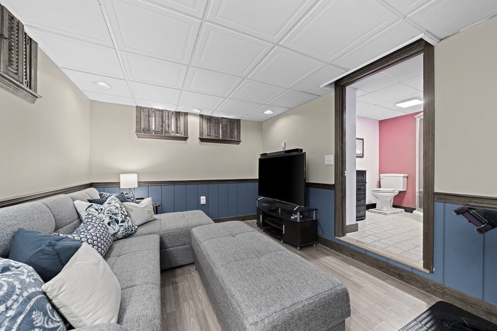 14 Edith Road Weymouth, MA 02189 - Photo 23 of 35 a living room with furniture and a flat screen tv