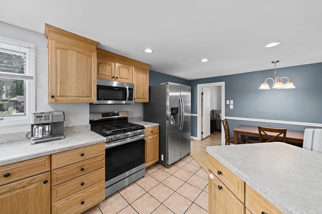 14 Edith Road Weymouth, MA 02189 - Photo 8 of 35 a kitchen with sink cabinets and microwave