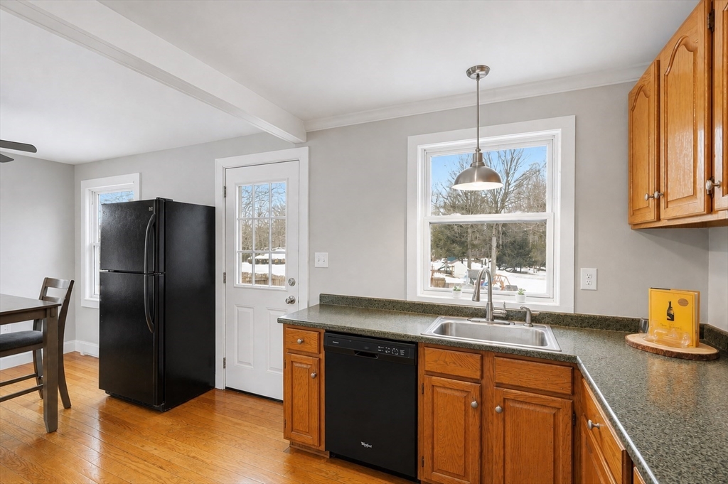 5 Marco Drive Pittsfield, MA 01201 - Photo 13 of 26 a kitchen with stainless steel appliances granite countertop a refrigerator a sink a stove and a wooden floors