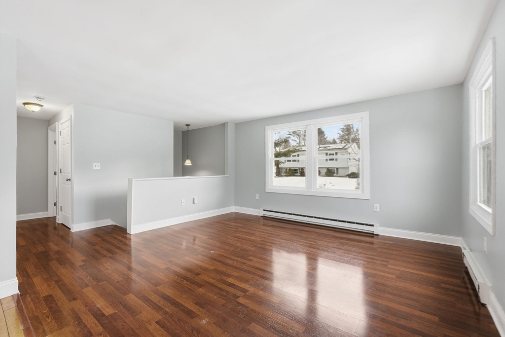 5 Marco Drive Pittsfield, MA 01201 - Photo 16 of 26 a view of empty room with wooden floor and fan