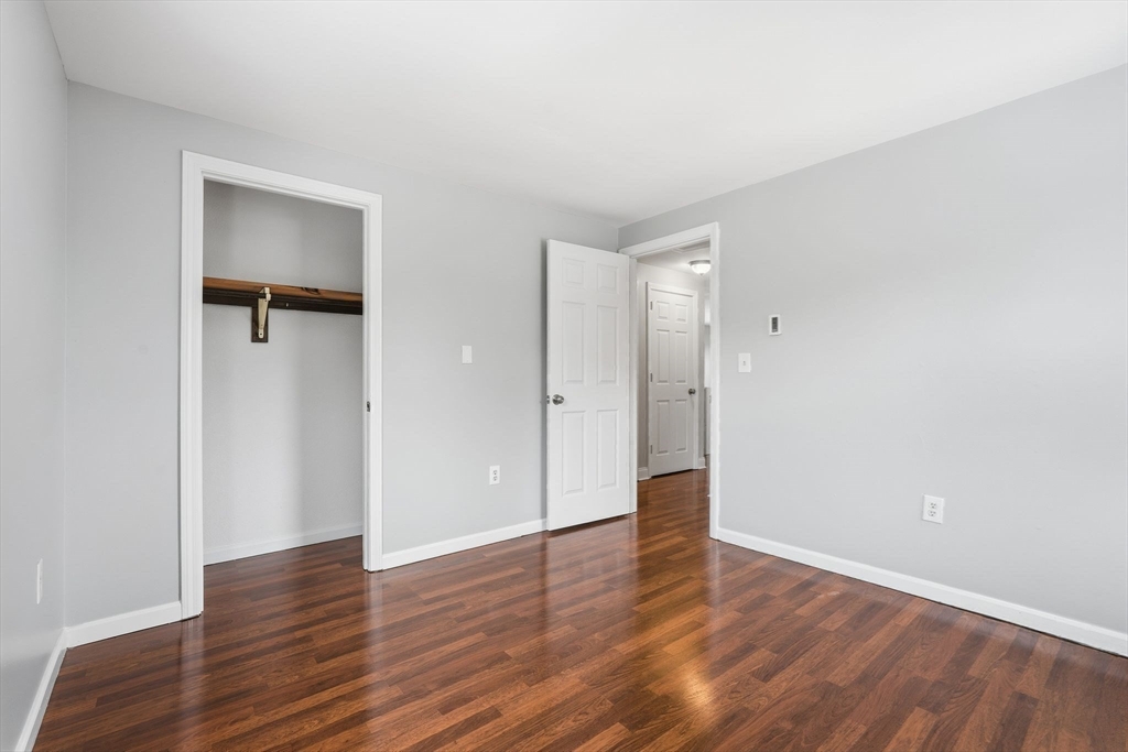 5 Marco Drive Pittsfield, MA 01201 - Photo 19 of 26 a view of an empty room with wooden floor