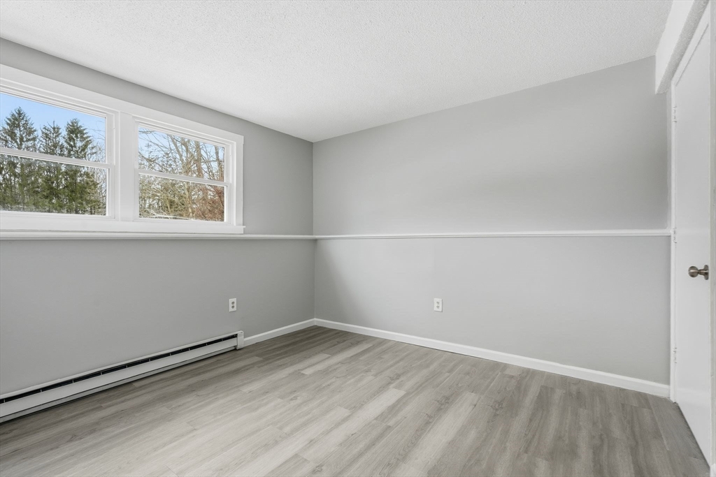 5 Marco Drive Pittsfield, MA 01201 - Photo 20 of 26 wooden floor in an empty room with a window