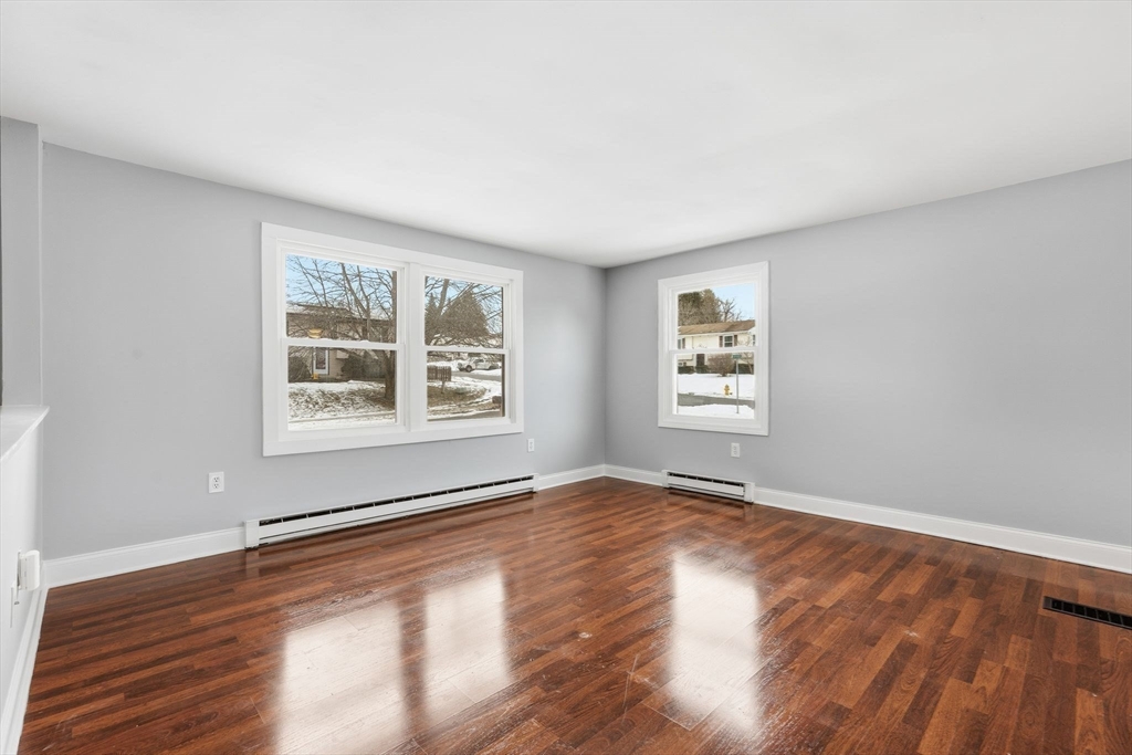 5 Marco Drive Pittsfield, MA 01201 - Photo 20 of 42 a view of an empty room with wooden floor and a window