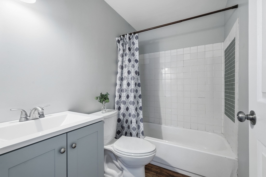 5 Marco Drive Pittsfield, MA 01201 - Photo 5 of 42 a bathroom with a bathtub shower sink vanity mirror and toilet