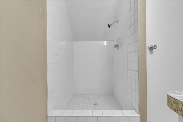 a view of a room with shelf on the wall