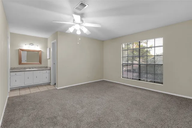 a bathroom with a shower and a toilet