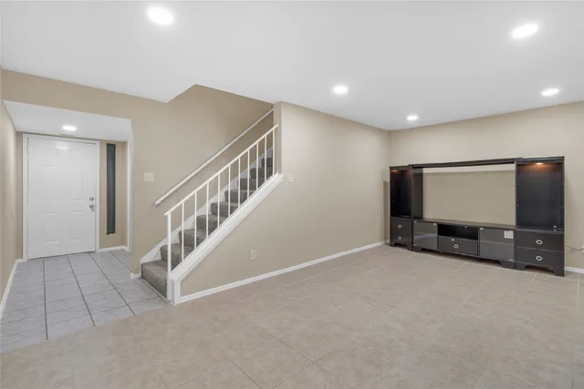 a kitchen with a table and chairs in it