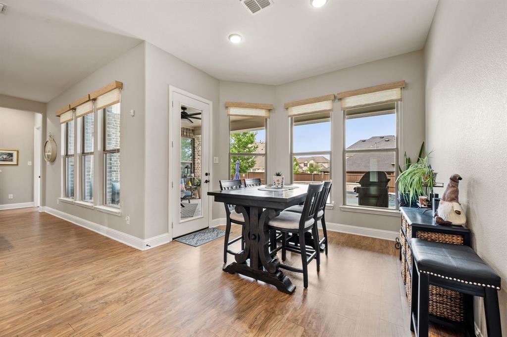 1226 Aster Place Haslet, TX 76052 - Photo 10 of 40 a view of a dining room with furniture window and wooden floor