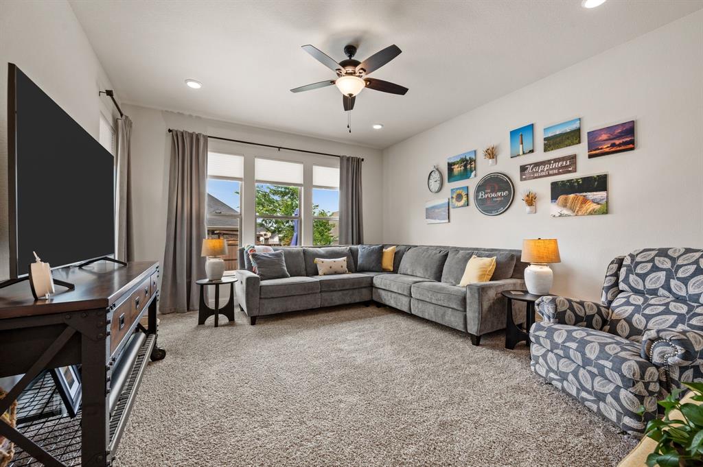 1226 Aster Place Haslet, TX 76052 - Photo 11 of 40 a living room with furniture and a flat screen tv