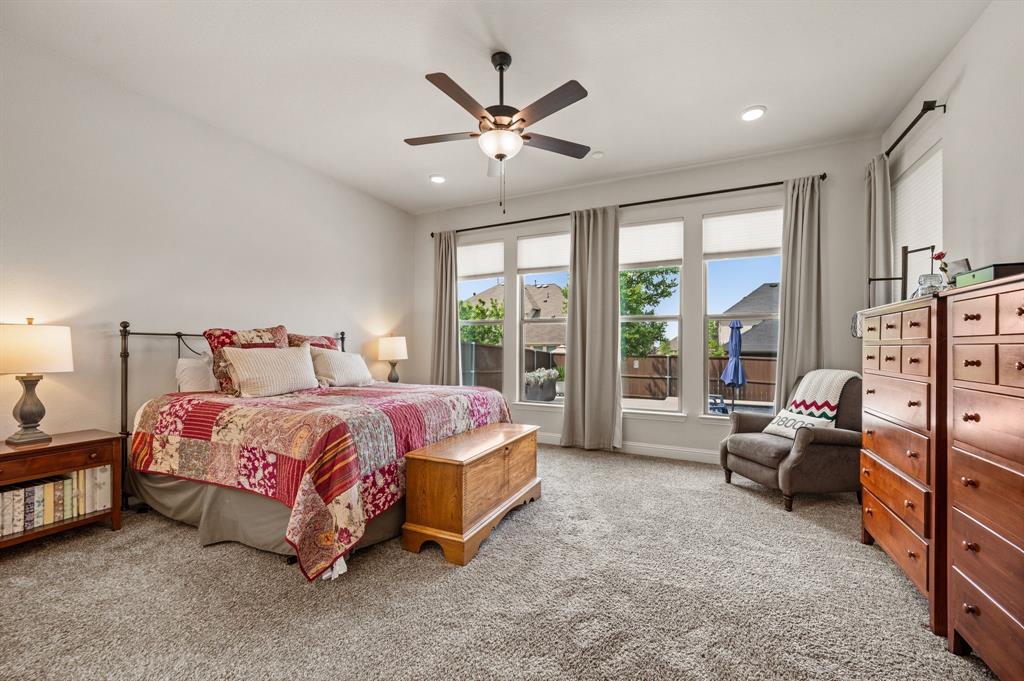 1226 Aster Place Haslet, TX 76052 - Photo 12 of 40 a bedroom with a bed and a large window
