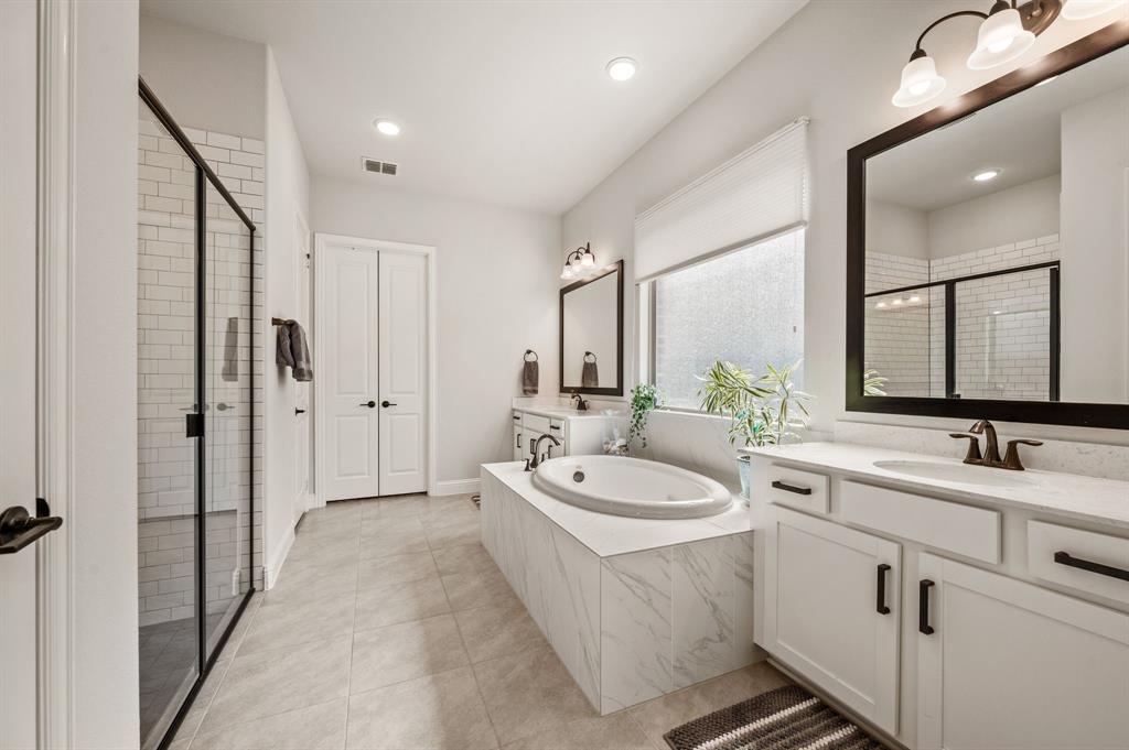 1226 Aster Place Haslet, TX 76052 - Photo 14 of 40 a spacious bathroom with a double vanity sink mirror and double