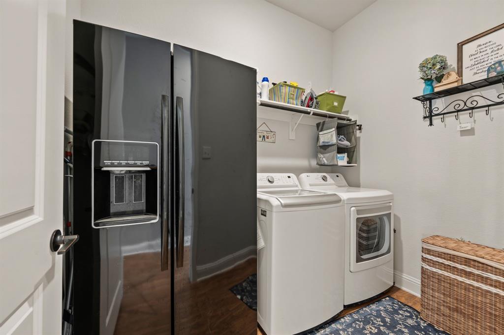 1226 Aster Place Haslet, TX 76052 - Photo 17 of 40 a view of a refrigerator and storage in a room