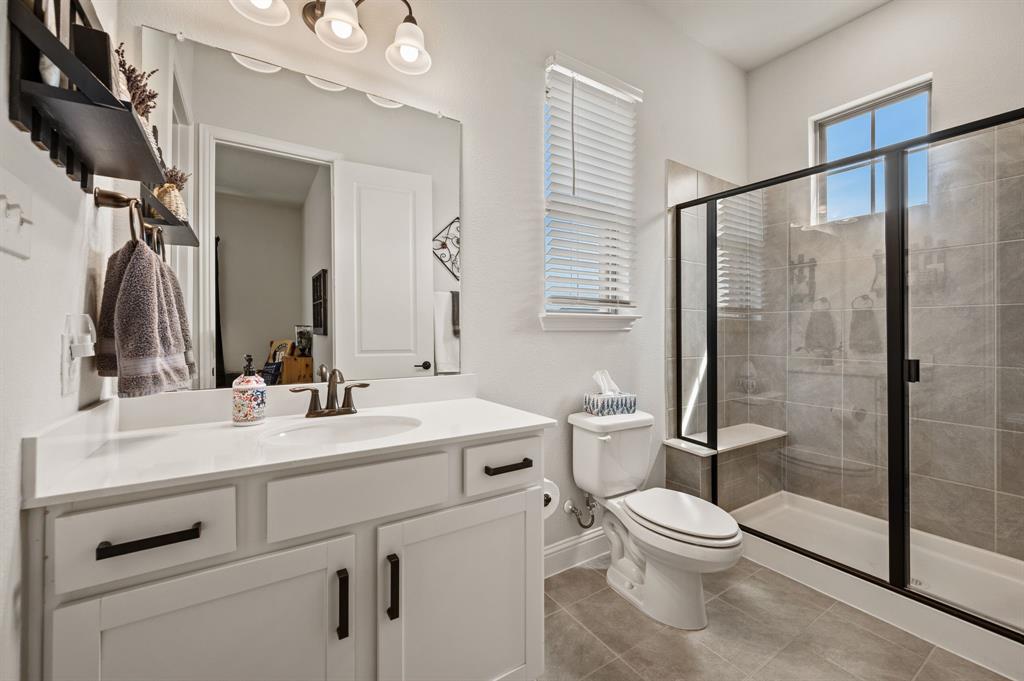 1226 Aster Place Haslet, TX 76052 - Photo 19 of 40 a bathroom with a sink a toilet and a mirror