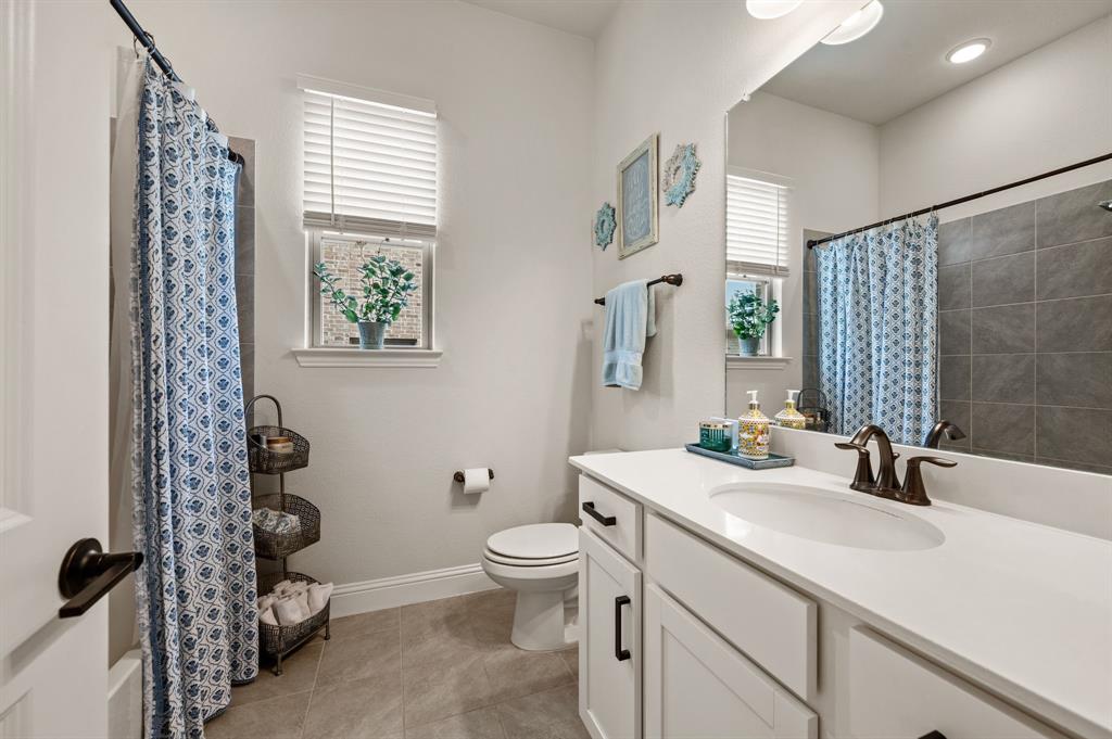 1226 Aster Place Haslet, TX 76052 - Photo 21 of 40 a bathroom with a sink toilet and shower