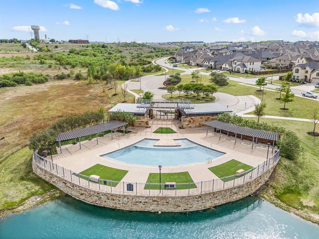 1226 Aster Place Haslet, TX 76052 - Photo 34 of 40 a view of a swimming pool with a lake